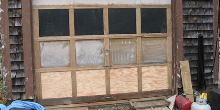 wooden garage door panel repair in Applewood